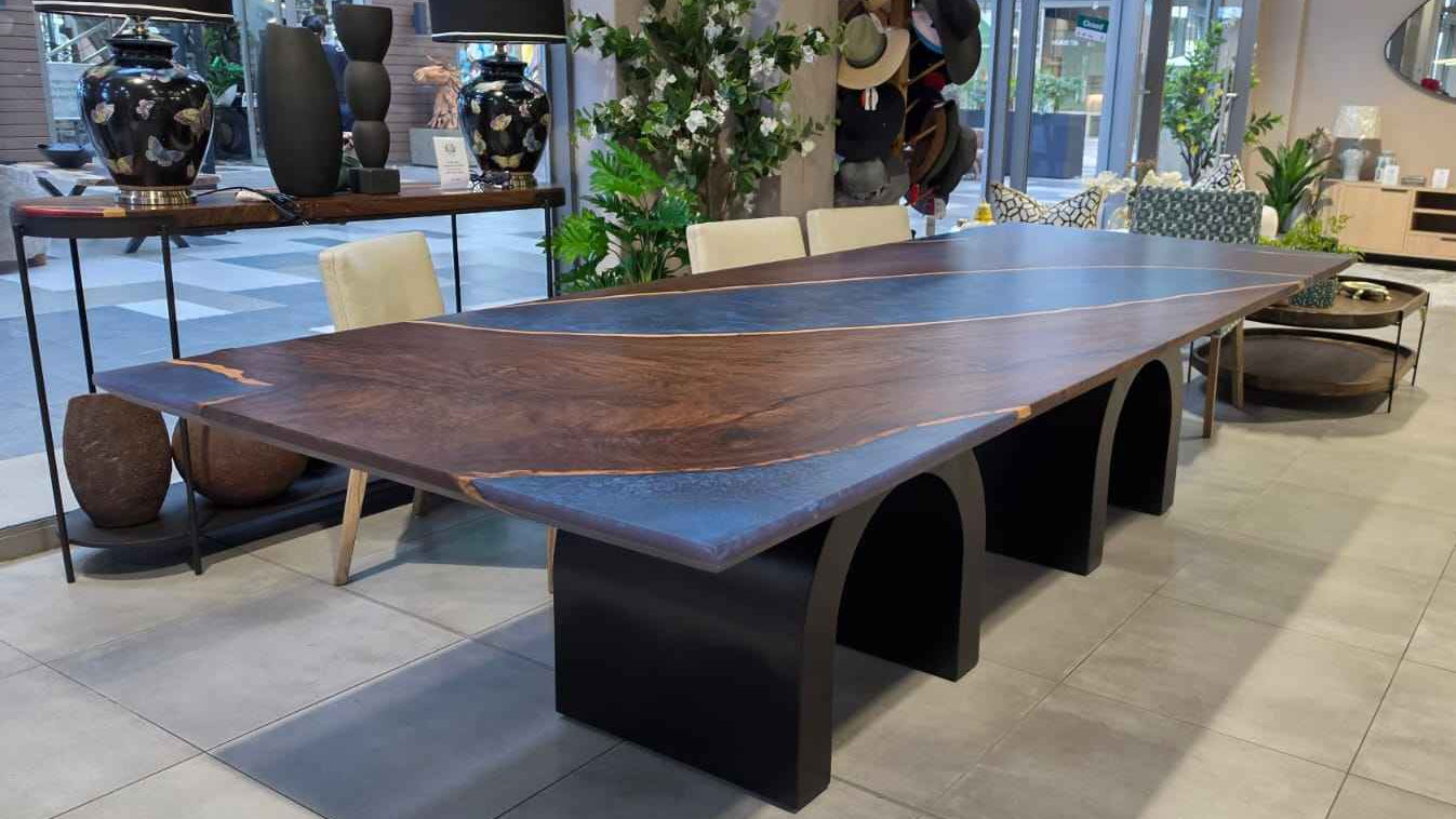 Leadwood table with arched metal legs