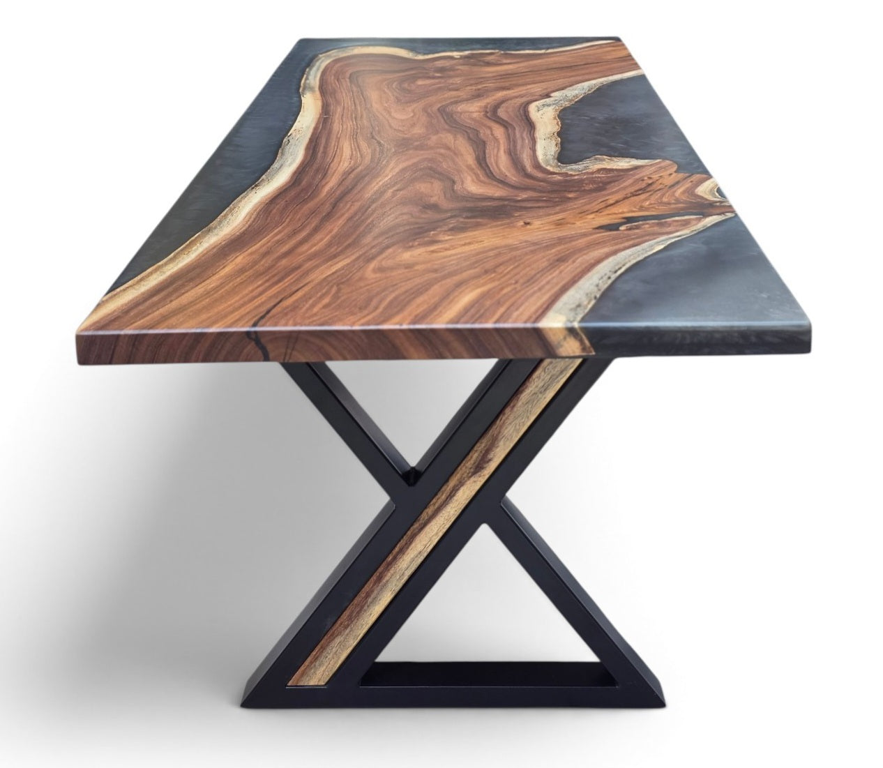 A live-edge wood table with a rich brown and golden wood grain top and a black metal X-shaped base, shown on a clean white background.